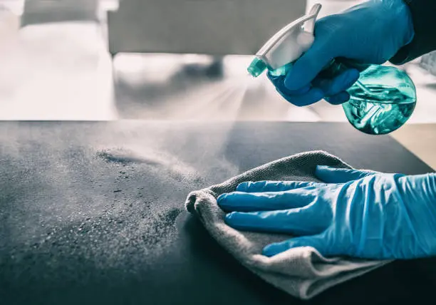 Table surface being sanitized – office and general cleaning by Cleanit Center in Nairobi